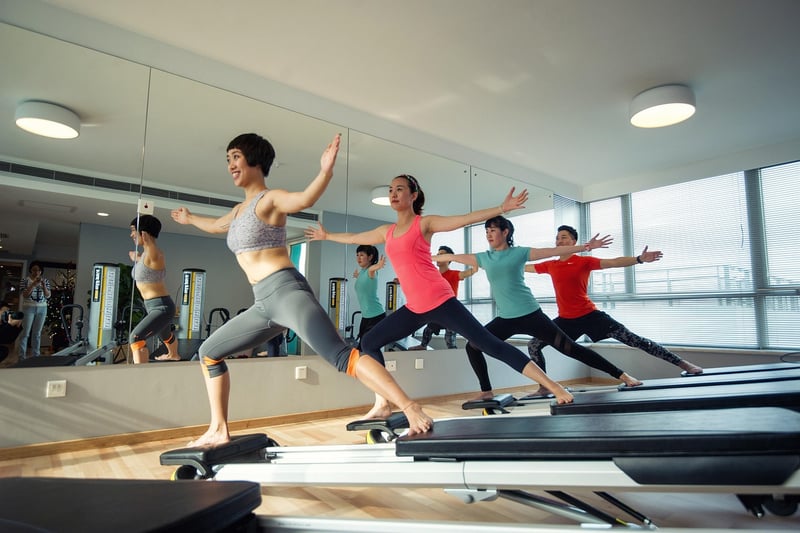 Woman doing core exercises on a Reformer